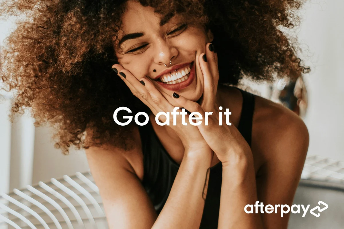 Afterpay campaign: 'Go after it' with a smiling woman