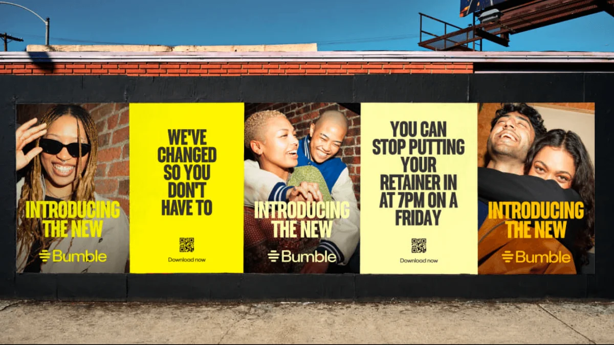 Vallas publicitarias de Bumble en una pared de la calle