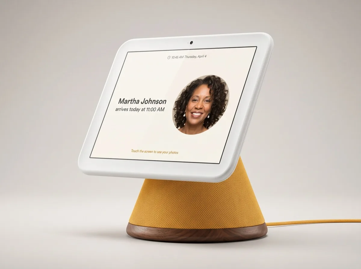 Honor Frame prototype, a white-framed touchscreen on a marigold fabric cone with a walnut base, showing that a caregiver arrives today at 11:00 AM