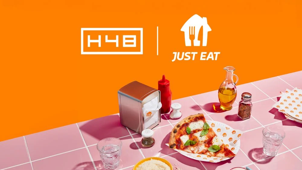 Just Eat ad with a meal on pink