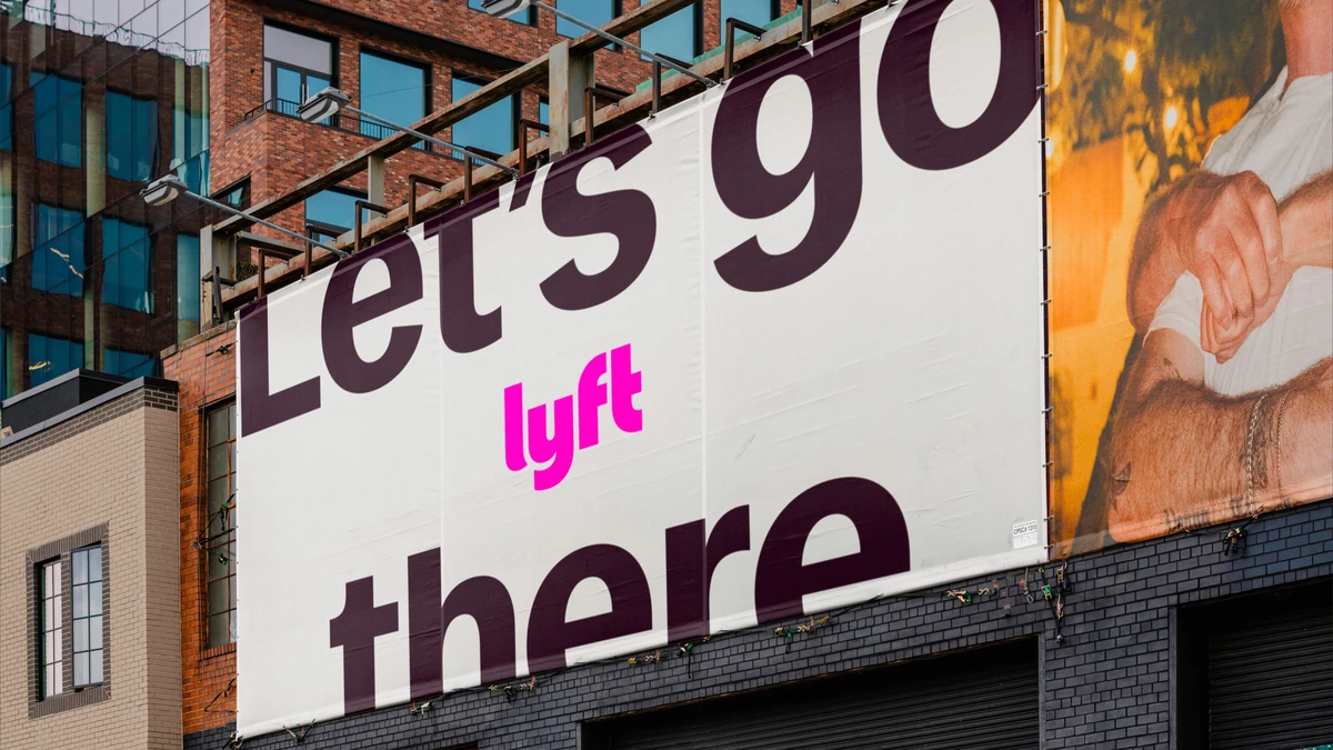 Valla publicitaria de Lyft en un edificio: «Let's go there»
