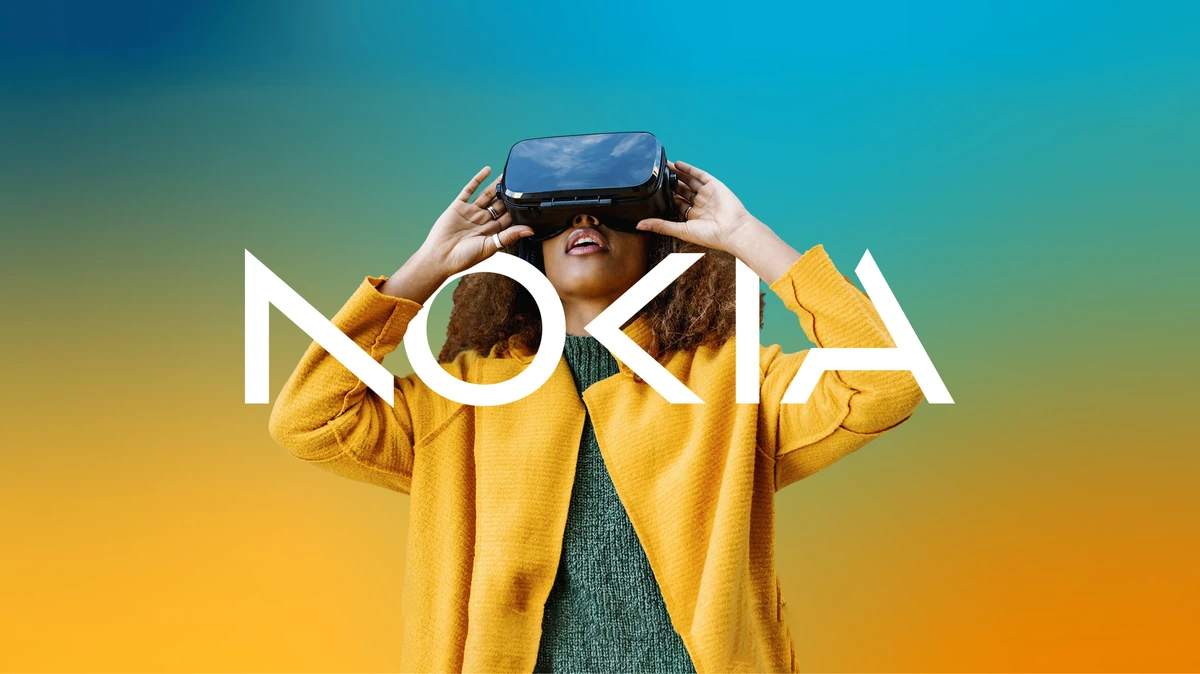 Nokia wordmark over a person in a yellow coat