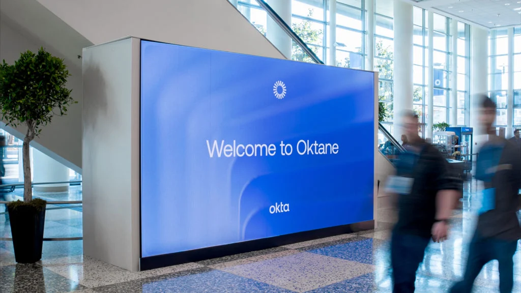 'Welcome to Oktane' screen in a lobby
