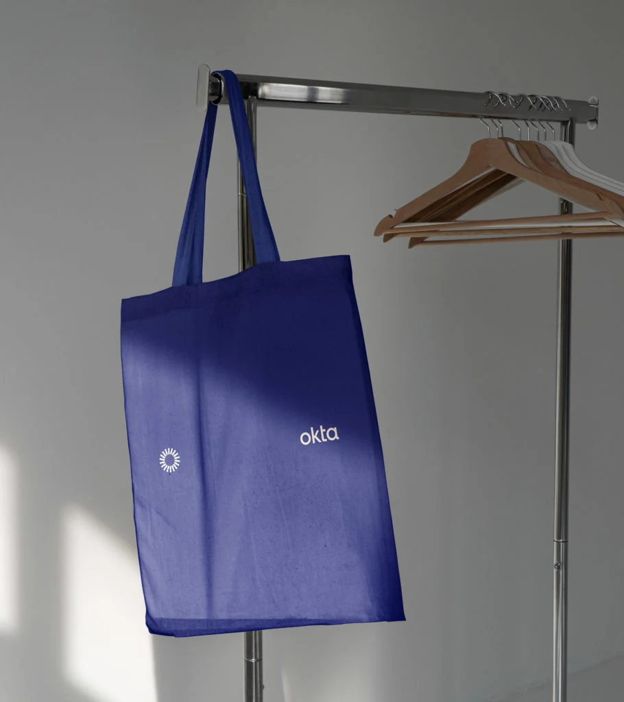 Okta tote bag on a hanger