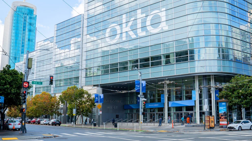 Okta wordmark on a headquarters facade