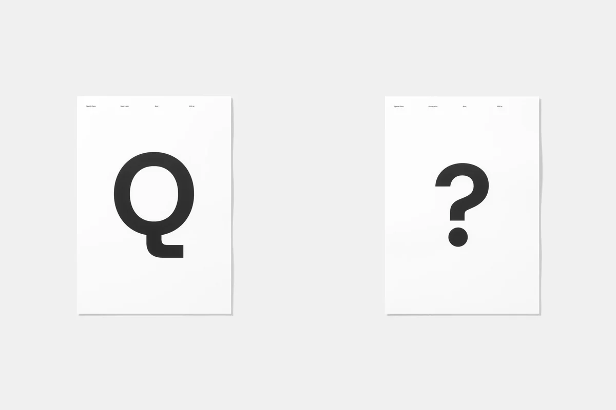 Glifos «Q» y «?» de OpenAI Sans en tarjetas