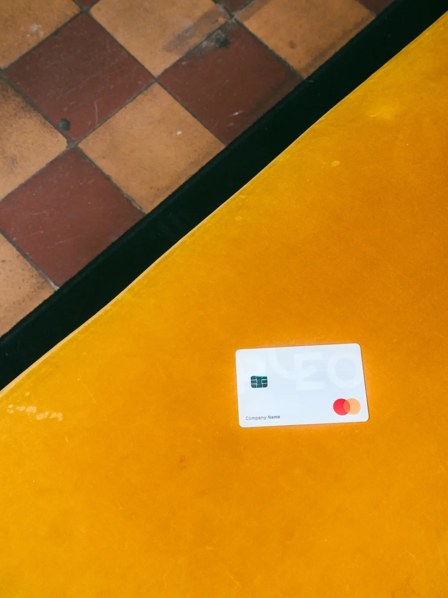 Pleo card on a yellow surface