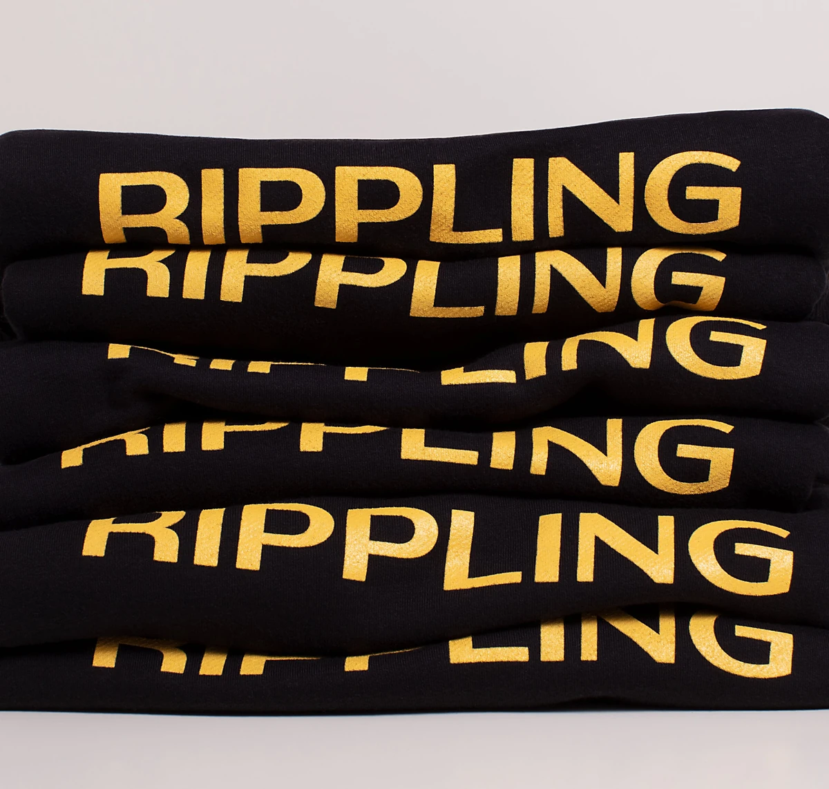 Repeated Rippling wordmarks on a black banner