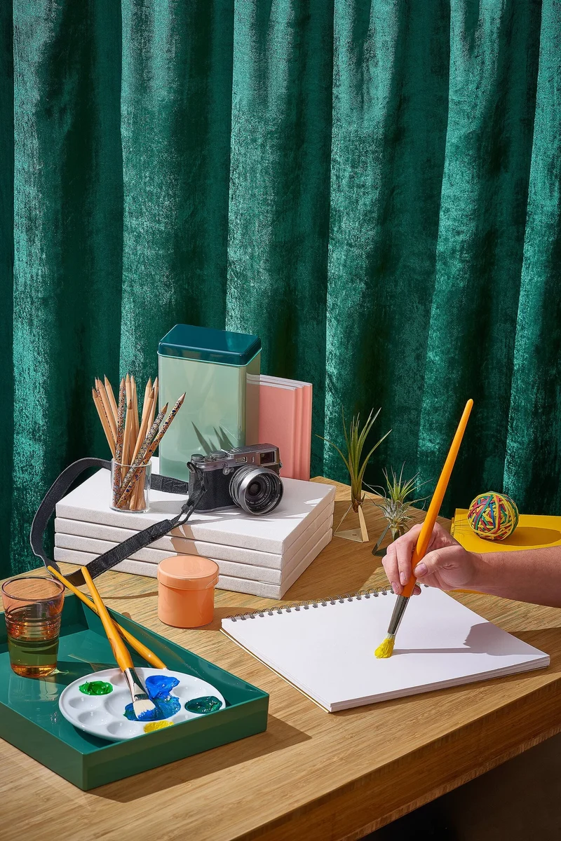 Skillshare product shot on a green textured background