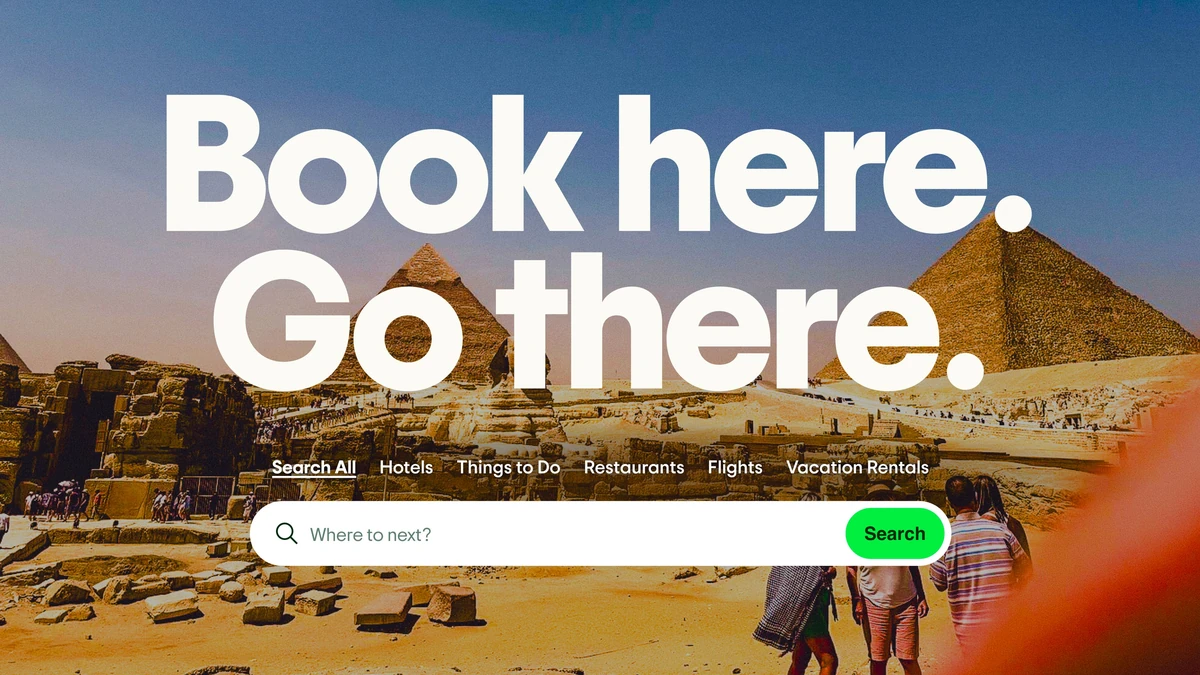 Tripadvisor ad: 'Book here. Go there.' over the pyramids
