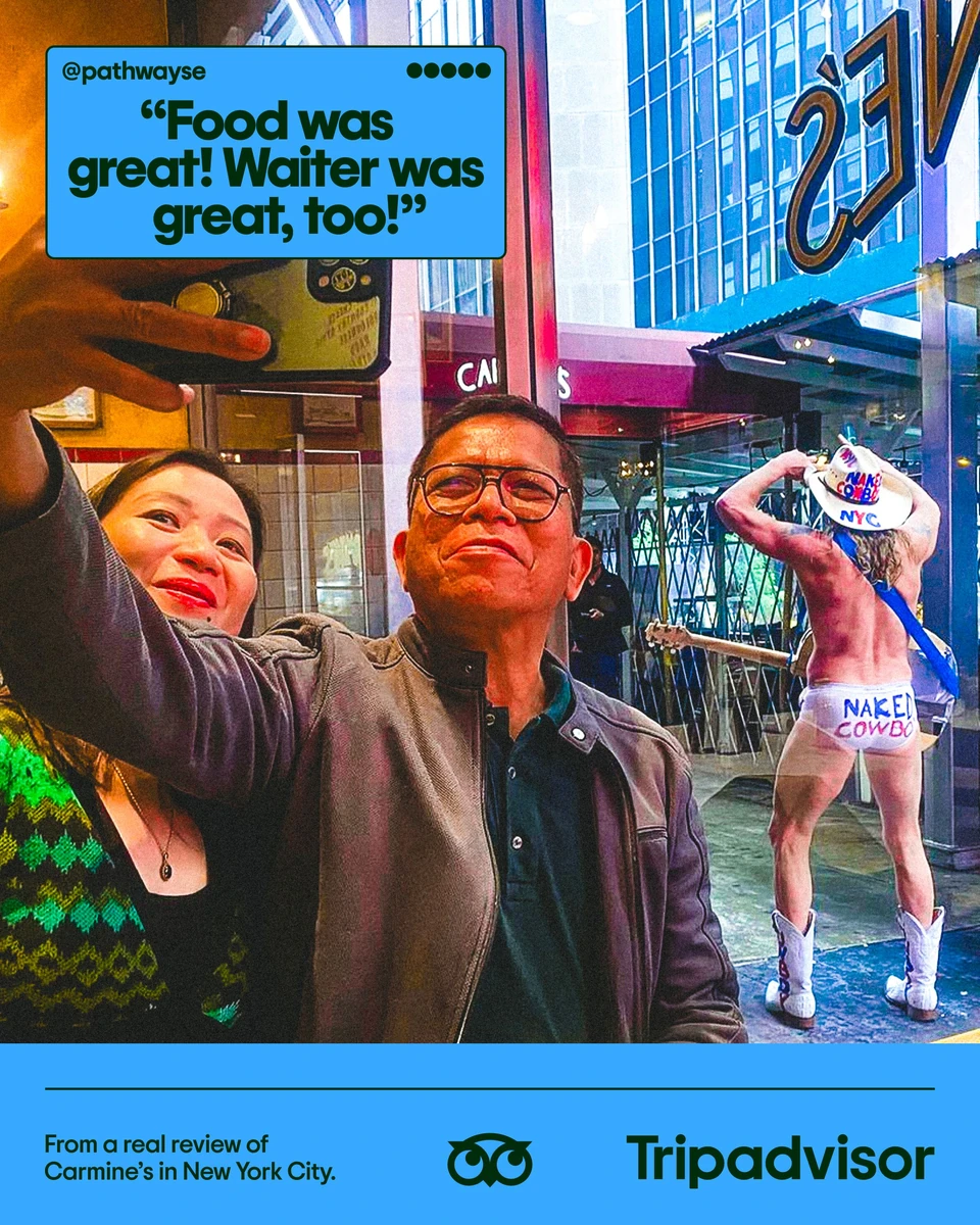 Tripadvisor poster with a selfie in a busy city