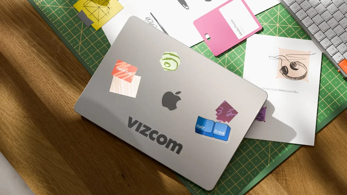 Pegatinas para portátil y papelería con la marca Vizcom sobre un escritorio