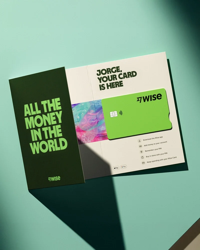 Folleto impreso de Wise: «All the money in the world» sobre verde azulado