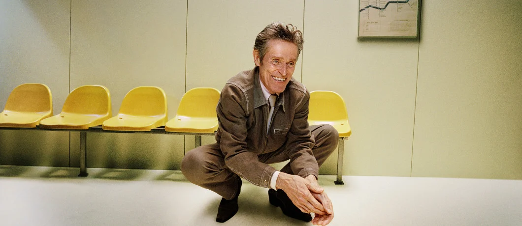 Zalando campaign still: a man seated on yellow chairs